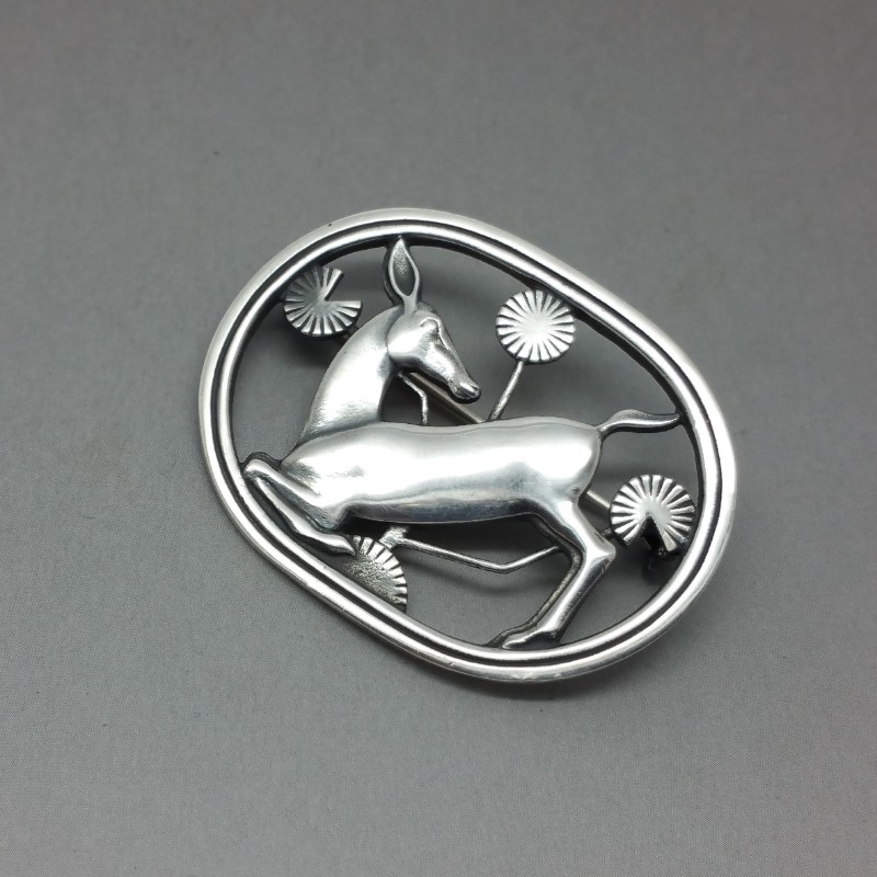 Malinowski kneeling deer brooch